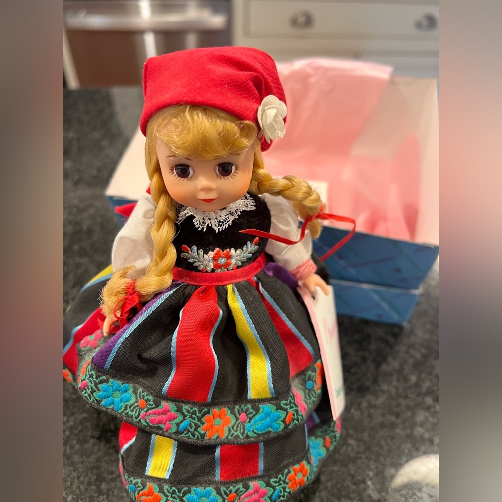 Like New Madame Alexander Poland Doll  with stand and original box.